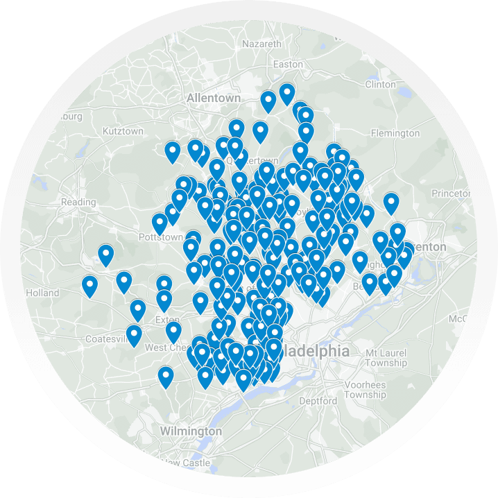 A map showing the Philadelphia area with numerous blue location markers highlights where TLC Drain provides its expert services across the region.